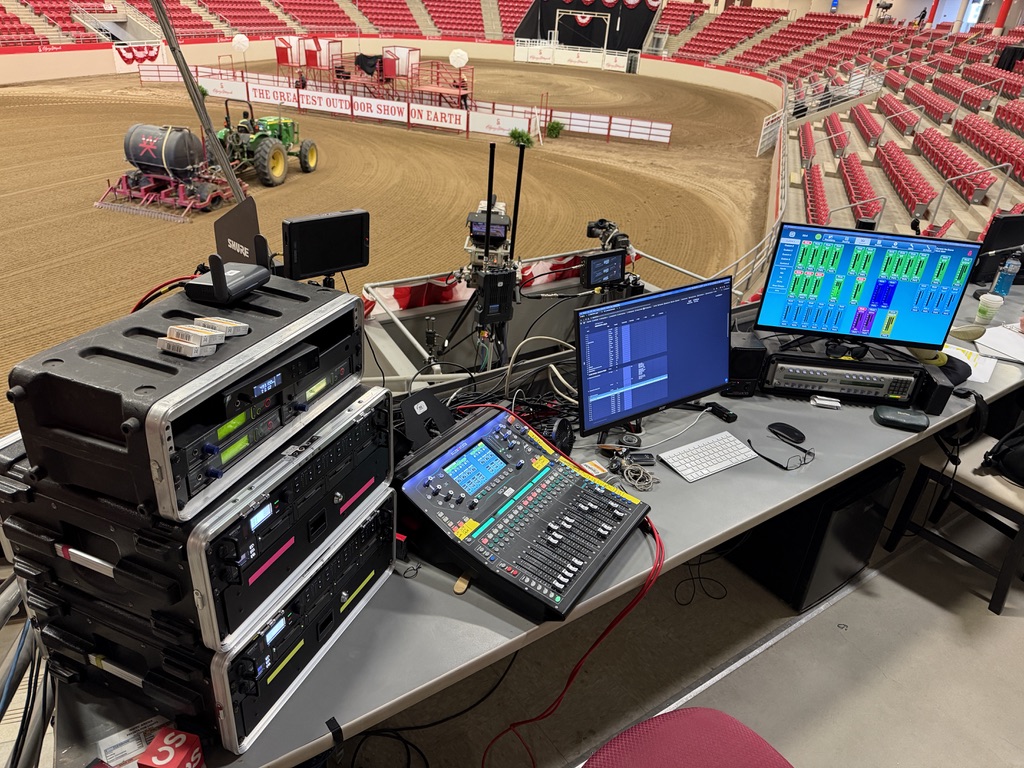 Audio and video control rack with mixing console and monitors during Calgary Stampede