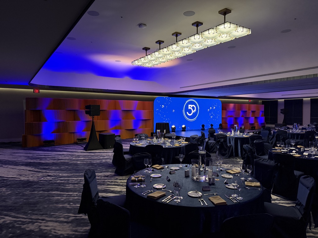 Quadra 50th anniversary ballroom in Houston with red and blue lighting