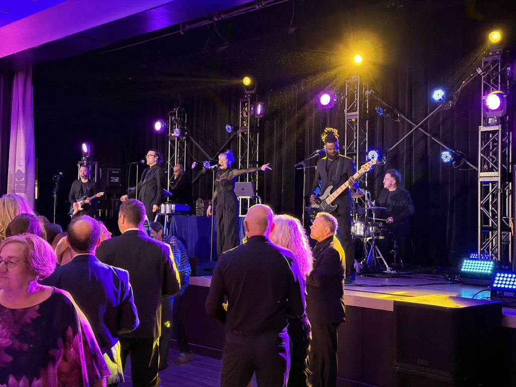Live band on a truss stage at Quadra's 50th anniversary in Montreal