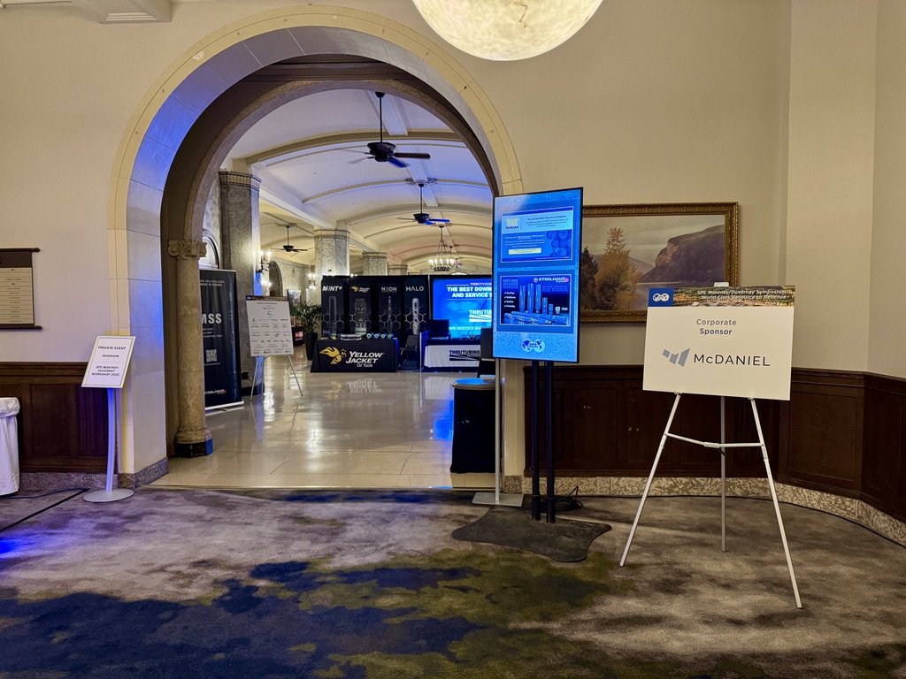 Digital signage and welcome screens in a hotel foyer for SPE Canada